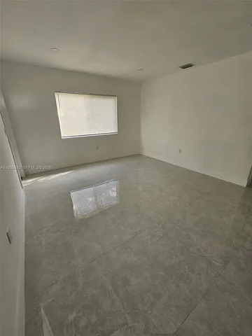 a kitchen with stainless steel appliances and a refrigerator