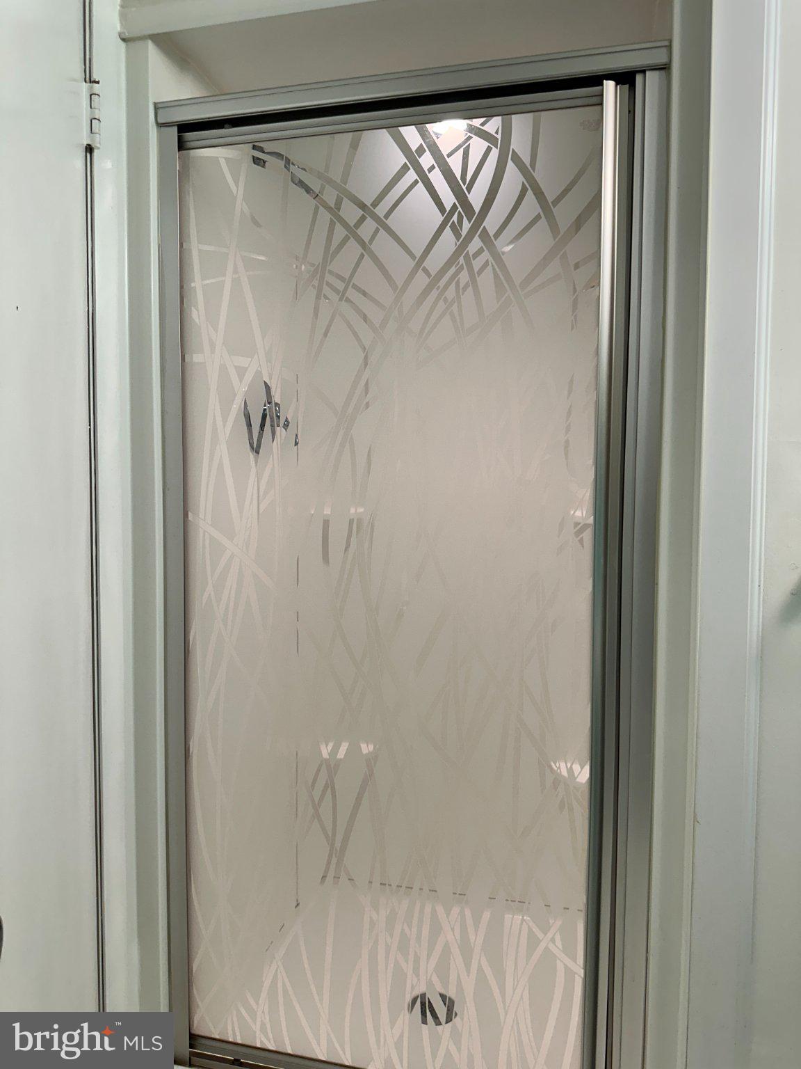 8336 Scotts Level Road Baltimore, MD 21208 - Photo 44 of 55 Elegant glass shower with modern design.
