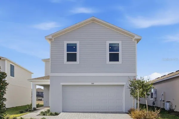 a front view of a house with garage