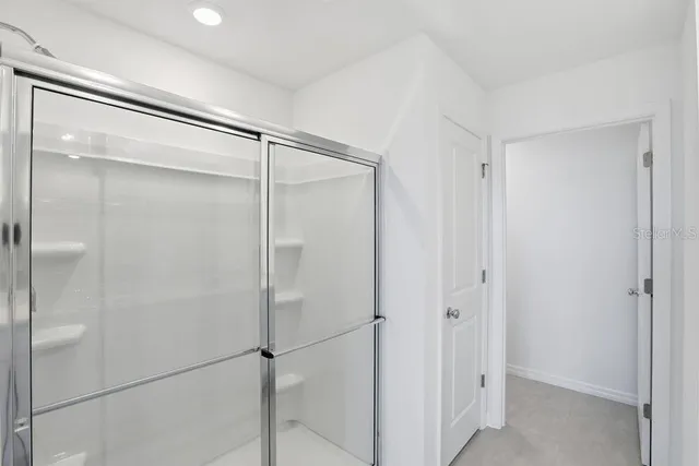 a bathroom with a sink double vanity and a mirror