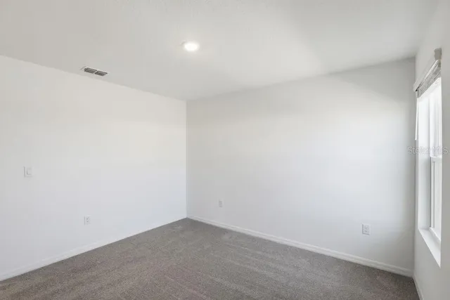 an empty room with window