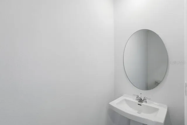 an empty room with a bathroom