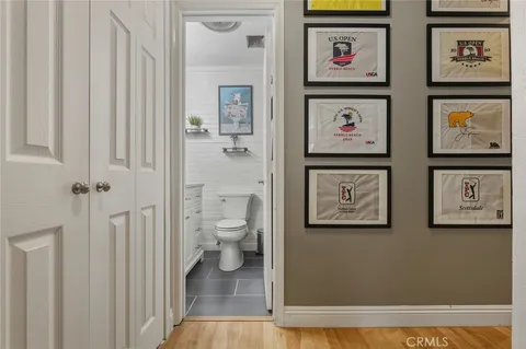 a bathroom with a toilet a sink and a mirror