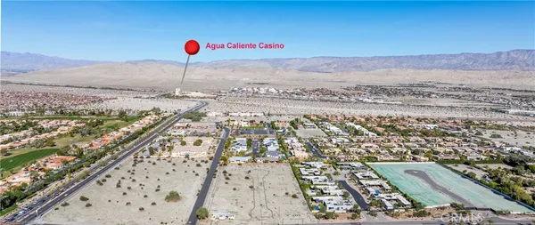 an aerial view of residential house and sandy dunes