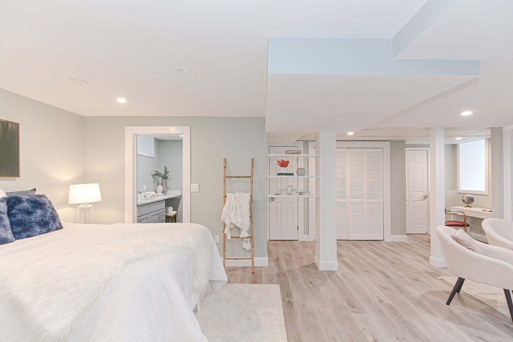 287 Cherry Street, Unit 1 Newton, MA 02465 - Photo 21 of 30 a spacious bedroom with a bed and a view of bathroom
