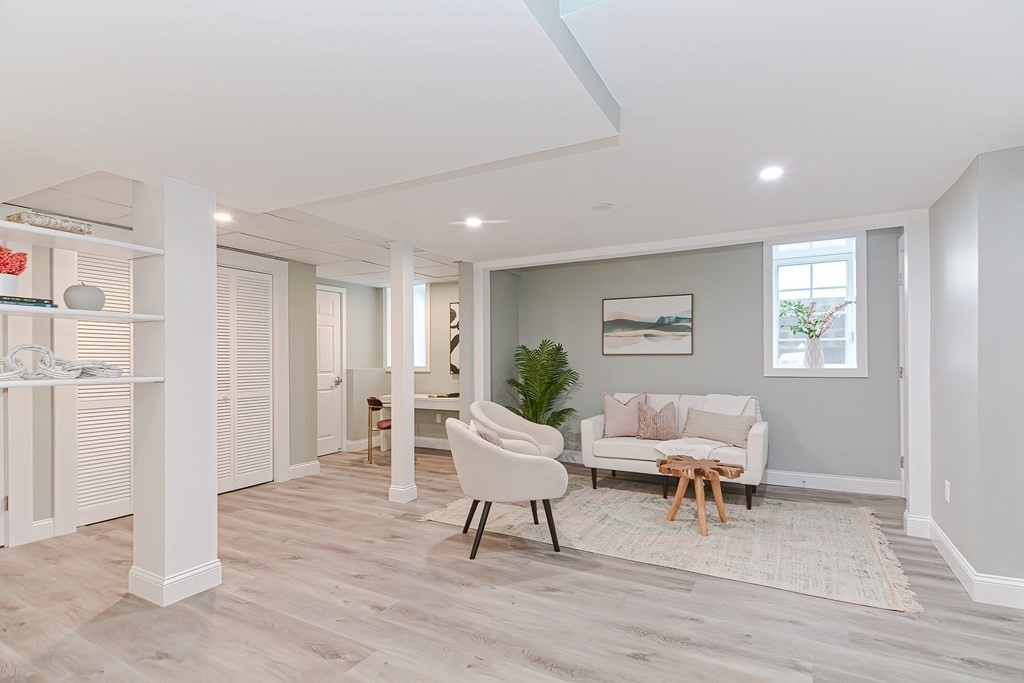 287 Cherry Street, Unit 1 Newton, MA 02465 - Photo 23 of 30 a living room with furniture and a wooden floor