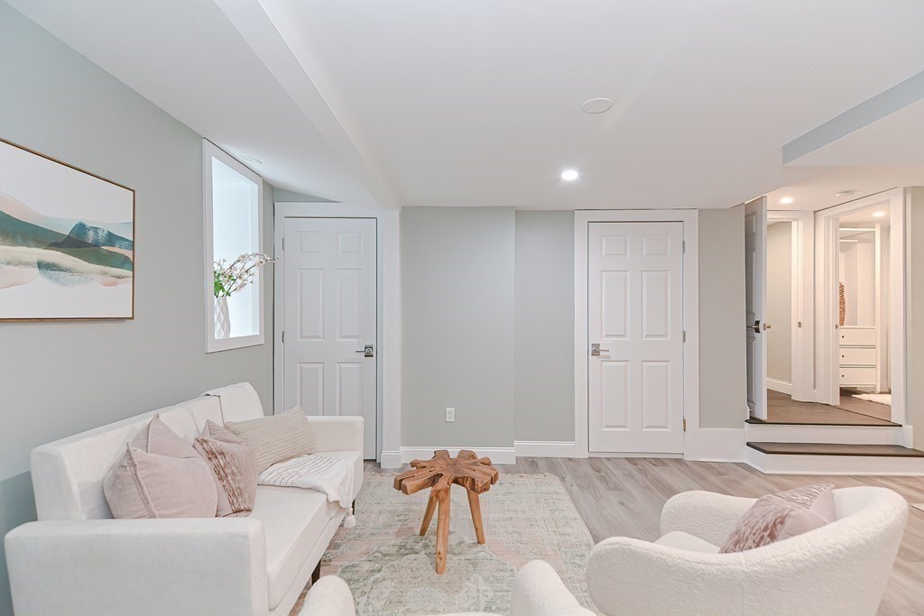 287 Cherry Street, Unit 1 Newton, MA 02465 - Photo 25 of 30 a living room with furniture and a window