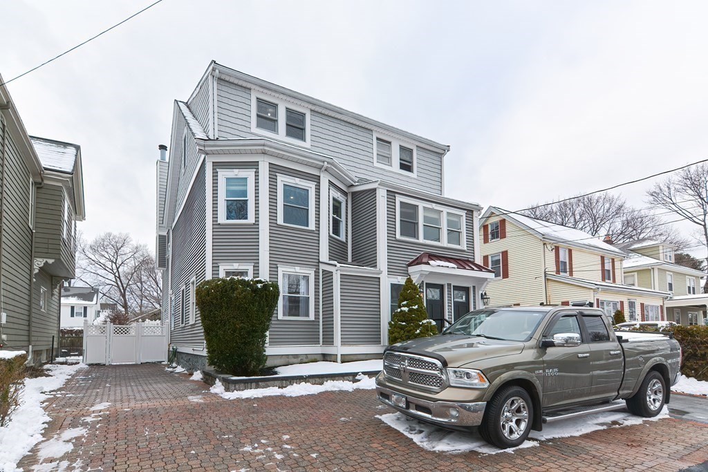287 Cherry Street, Unit 1 Newton, MA 02465 - Photo 27 of 30 a car parked in front of a building
