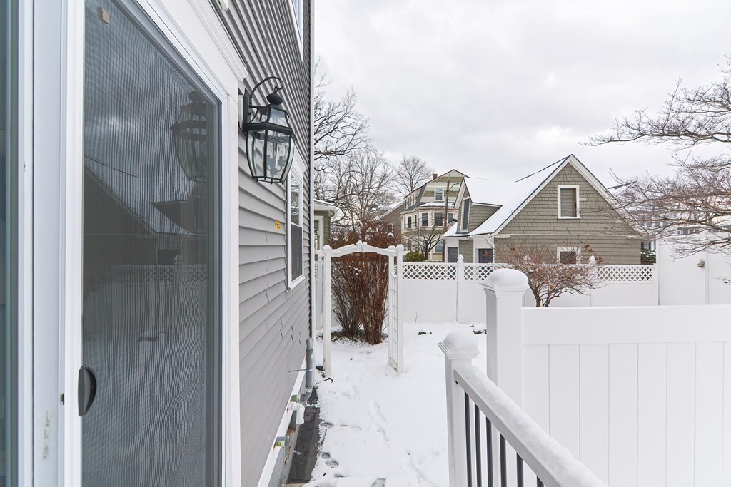 287 Cherry Street, Unit 1 Newton, MA 02465 - Photo 29 of 30 a view of a house with wooden fence