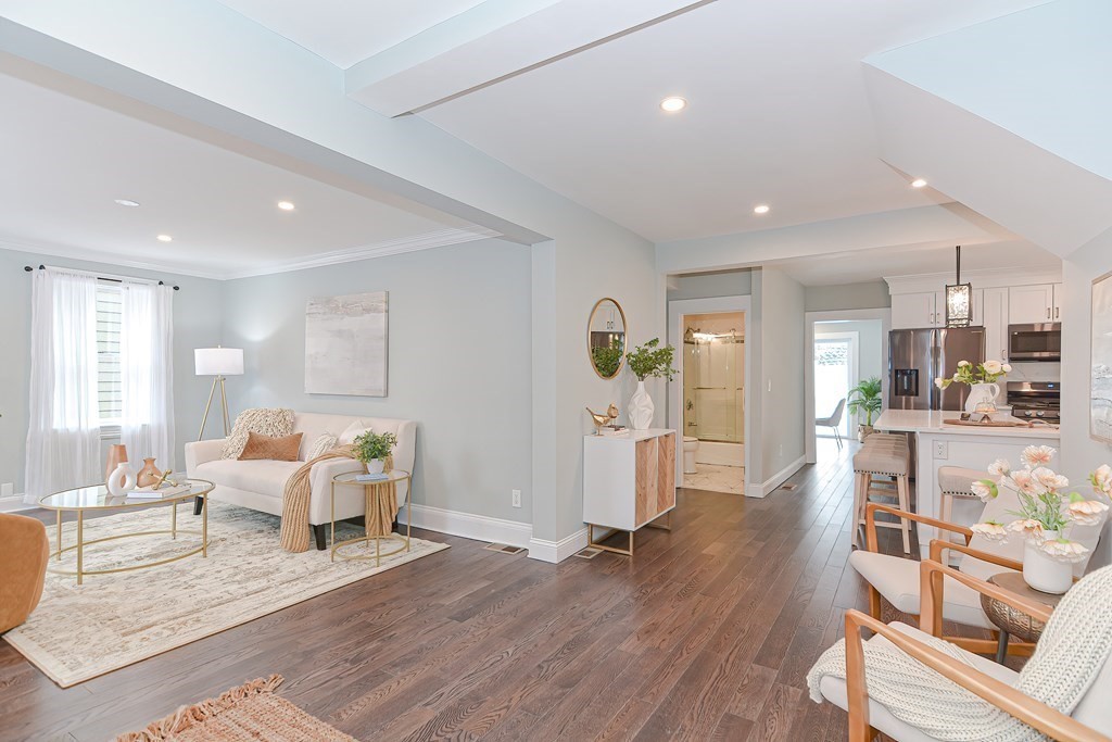 287 Cherry Street, Unit 1 Newton, MA 02465 - Photo 3 of 30 a living room with furniture and a wooden floor