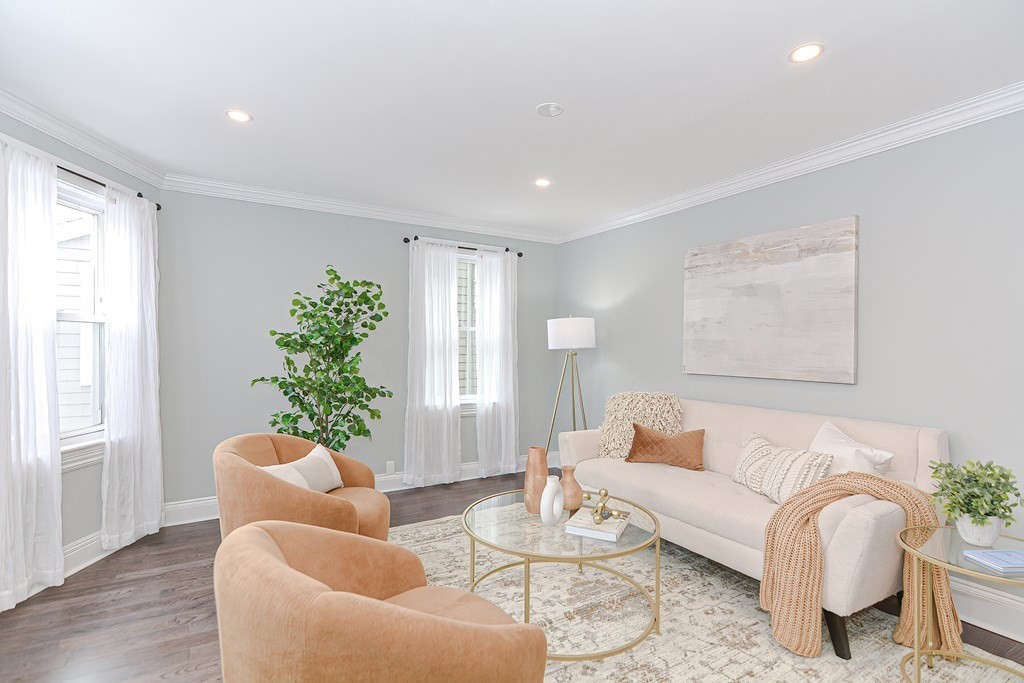 287 Cherry Street, Unit 1 Newton, MA 02465 - Photo 6 of 30 a living room with furniture potted plant and a window