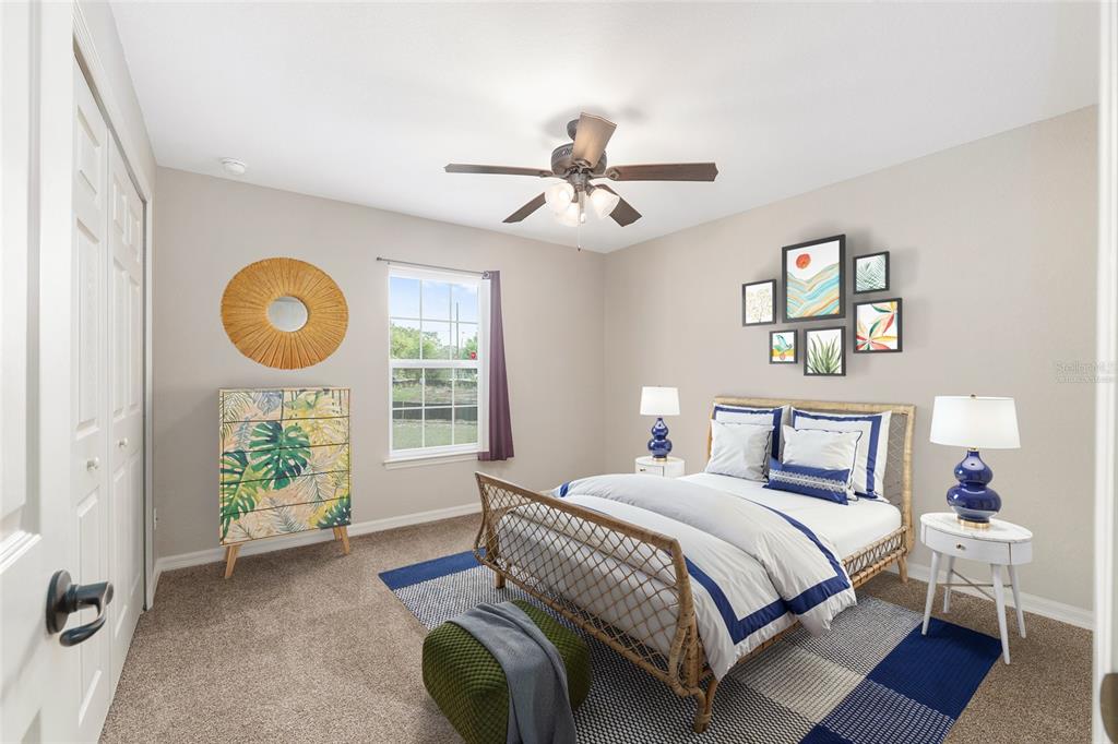 2 Hemlock Loop Drive Ocala, FL 34472 - Photo 24 of 28 a bedroom with a bed and a chandelier