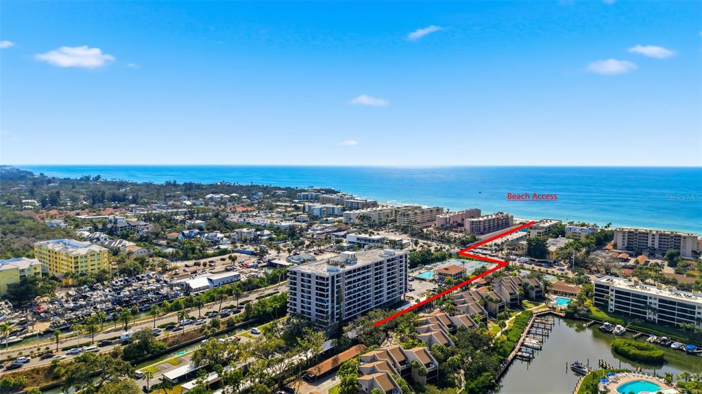6415 Midnight Pass Road, Unit 310 Sarasota, FL 34242 - Photo 1 of 62 an aerial view of multiple house