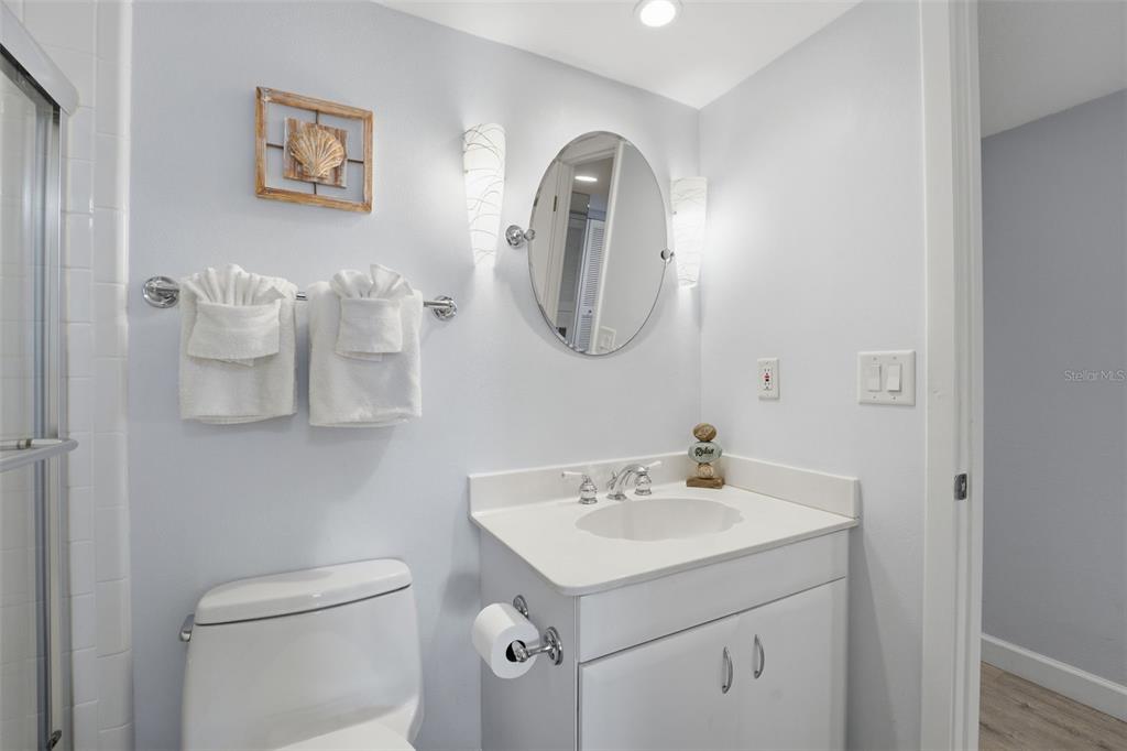 6415 Midnight Pass Road, Unit 310 Sarasota, FL 34242 - Photo 14 of 62 a bathroom with a sink and a mirror