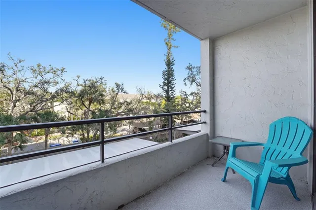 a bathroom with a shower a toilet and a glass door