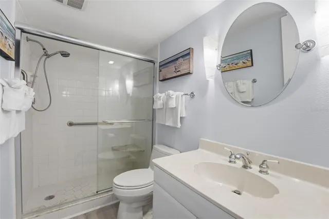 a view of a house with a yard and potted plants