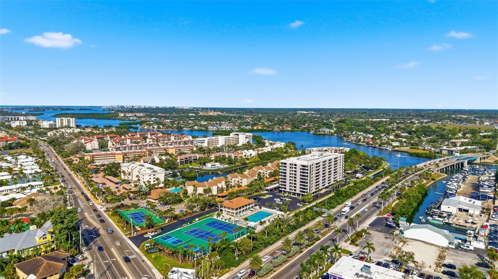 6415 Midnight Pass Road, Unit 310 Sarasota, FL 34242 - Photo 46 of 62 an aerial view of city and lake