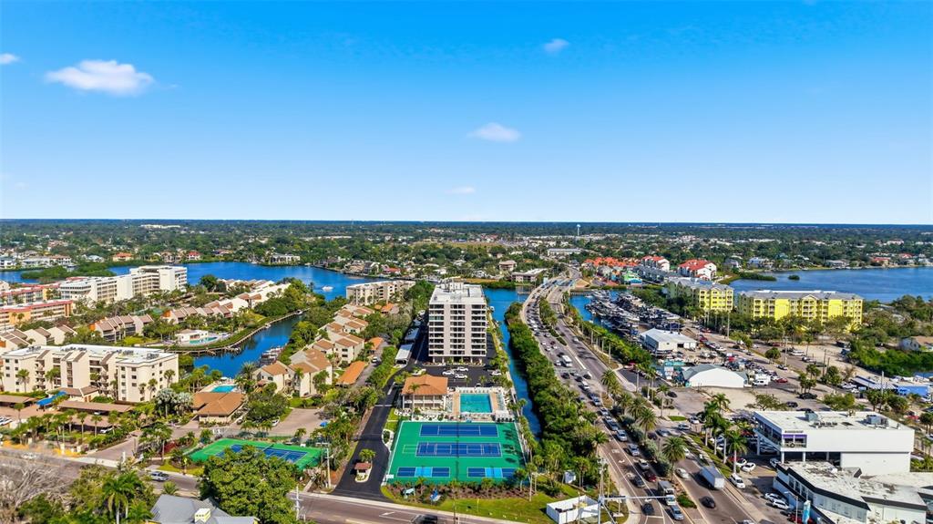 6415 Midnight Pass Road, Unit 310 Sarasota, FL 34242 - Photo 47 of 62 an aerial view of multiple house