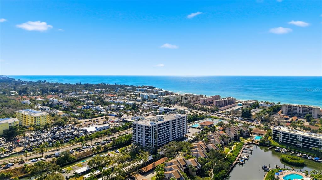 6415 Midnight Pass Road, Unit 310 Sarasota, FL 34242 - Photo 49 of 62 an aerial view of multiple house