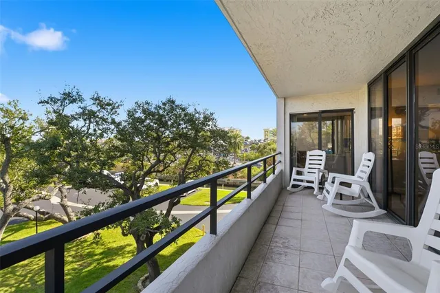 a view of two chairs in the balcony