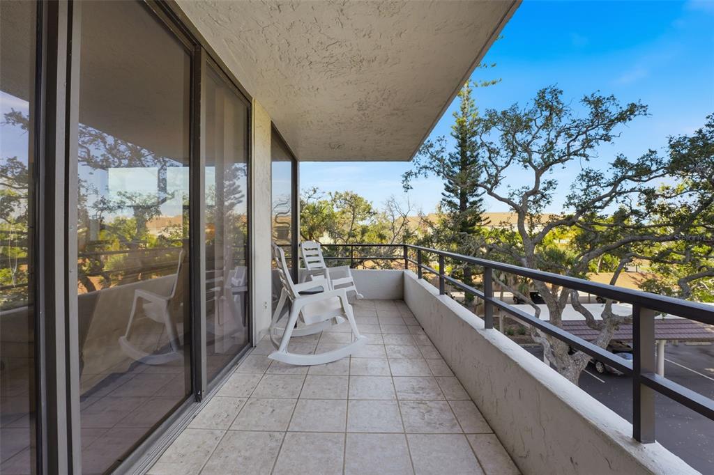 6415 Midnight Pass Road, Unit 310 Sarasota, FL 34242 - Photo 8 of 62 a view of city from a balcony