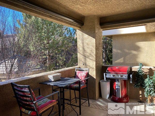 900 S Meadows, Unit 4423 Reno, NV 89521 - Photo 11 of 25 a outdoor sitting area with furniture and wooden floor