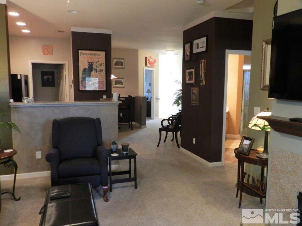 900 S Meadows, Unit 4423 Reno, NV 89521 - Photo 17 of 25 a living room with furniture and a fireplace