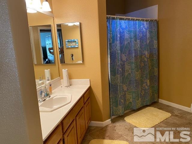 900 S Meadows, Unit 4423 Reno, NV 89521 - Photo 20 of 25 a bathroom with a sink a toilet and shower
