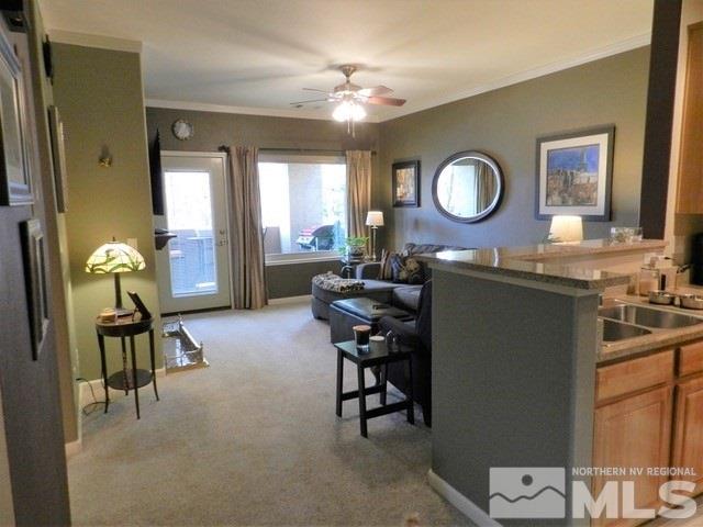 900 S Meadows, Unit 4423 Reno, NV 89521 - Photo 4 of 25 a living room with furniture and a mirror