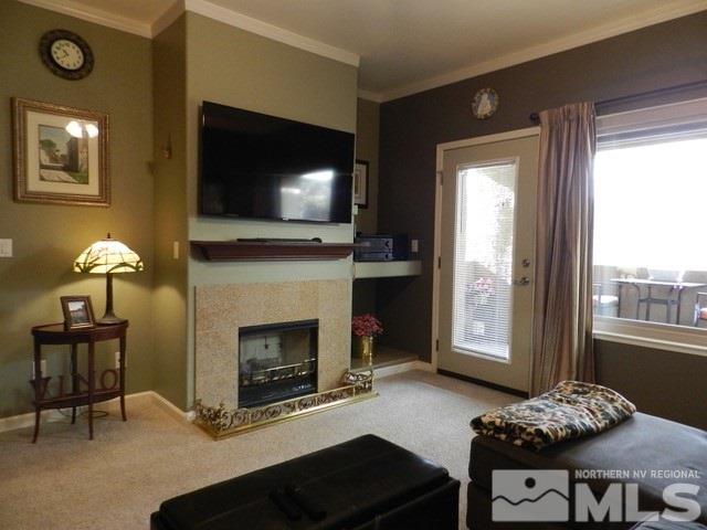 900 S Meadows, Unit 4423 Reno, NV 89521 - Photo 5 of 25 a living room with furniture and a fireplace