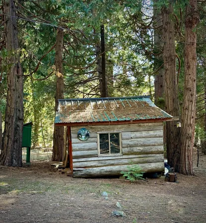 a view of a house with a yard and garage