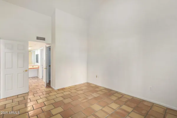 a bathroom with a sink double vanity granite and a mirror