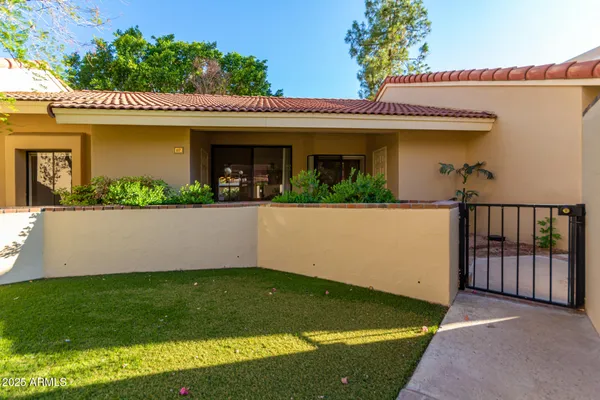 front view of a house with a yard
