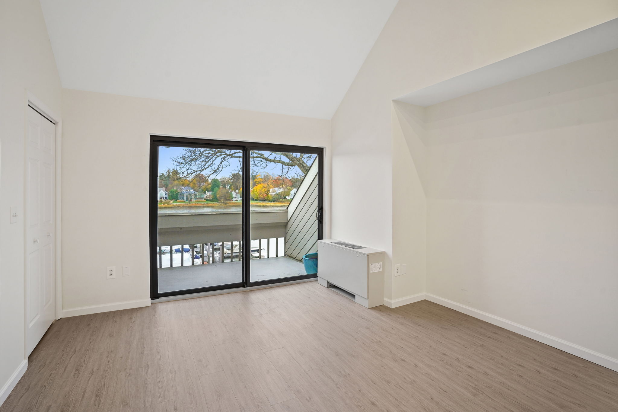 7 River Road, Unit 310 Norwalk, CT 06850 - Photo 12 of 21 wooden floor in an empty room with a window