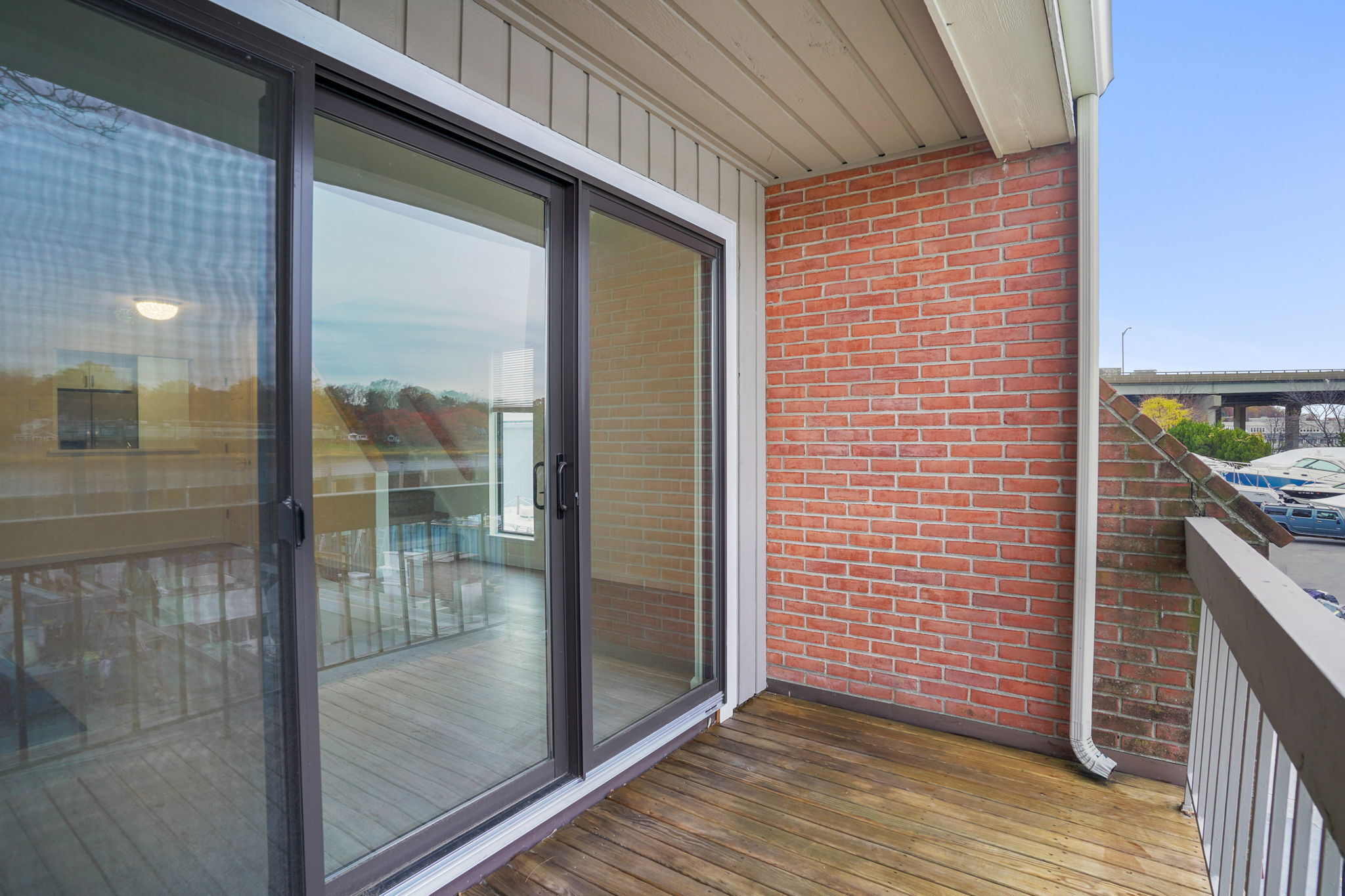 7 River Road, Unit 310 Norwalk, CT 06850 - Photo 18 of 21 a view of a glass door and an entryway