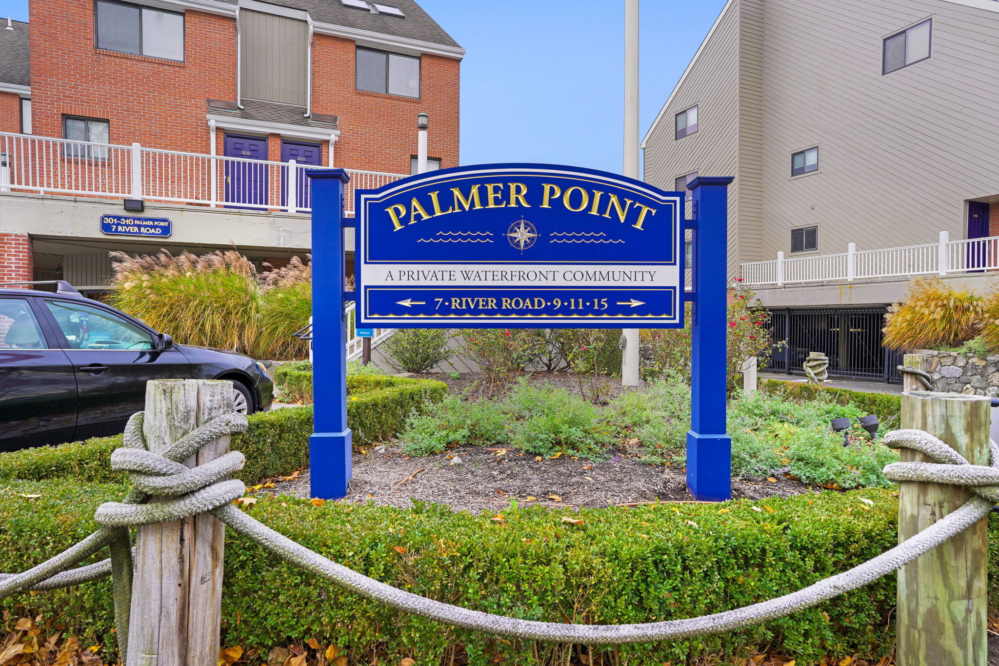 7 River Road, Unit 310 Norwalk, CT 06850 - Photo 2 of 21 a sign on the side of a building