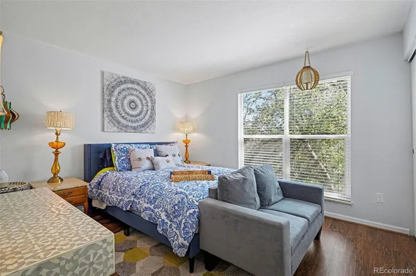 a bedroom with a bed and a couch