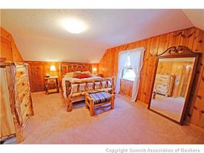 392 Alpine Road Dillon, CO 80435 - Photo 11 of 25 a bedroom with a bed and a table