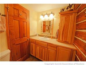 392 Alpine Road Dillon, CO 80435 - Photo 13 of 25 a bathroom with a sink and a mirror