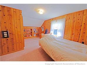 392 Alpine Road Dillon, CO 80435 - Photo 15 of 25 a bedroom with a bed and a night stand
