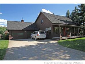 392 Alpine Road Dillon, CO 80435 - Photo 24 of 25 a front view of a house with a garden