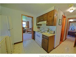 392 Alpine Road Dillon, CO 80435 - Photo 4 of 25 a kitchen with stainless steel appliances granite countertop a stove and a refrigerator