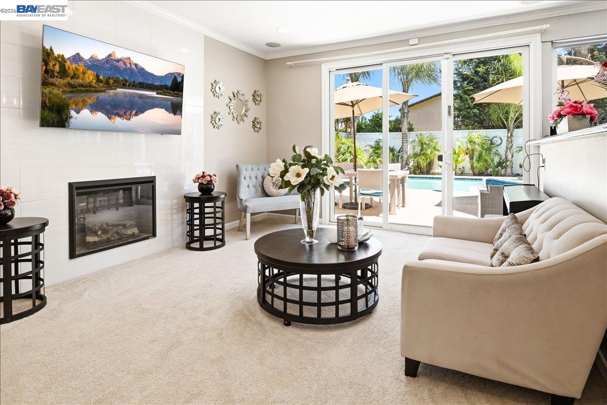 2861 Millbridge Place San Ramon, CA 94583 - Photo 24 of 58 a living room with furniture a fireplace and a flat screen tv