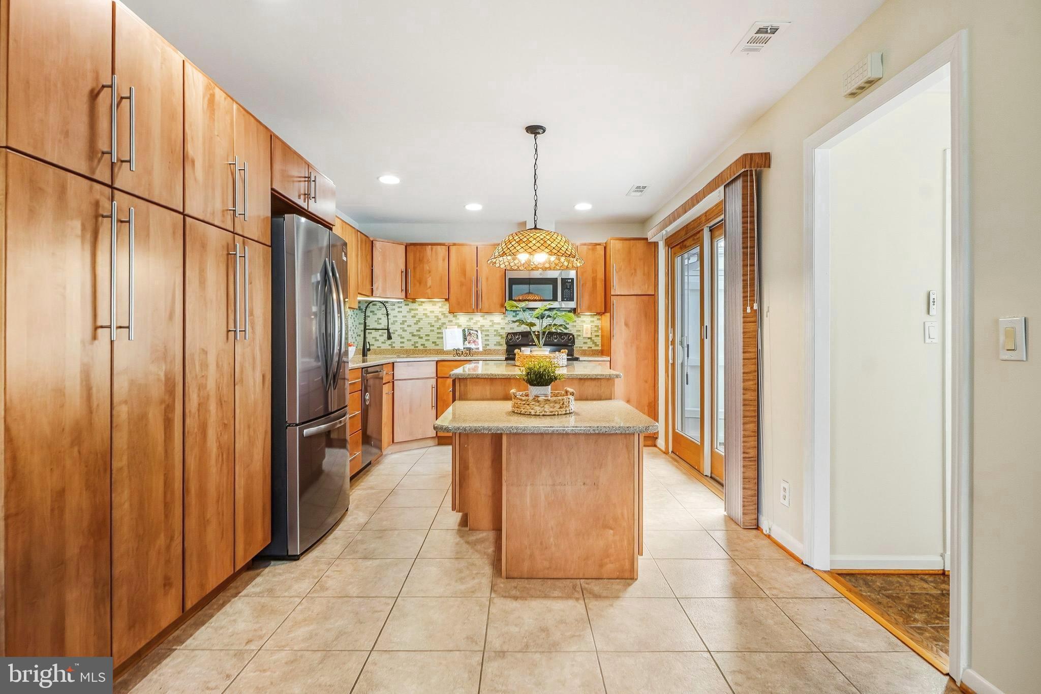 3506 Fiske Terrace, Unit 153A Silver Spring, MD 20906 - Photo 10 of 43 Updated kitchen with two islands with granite