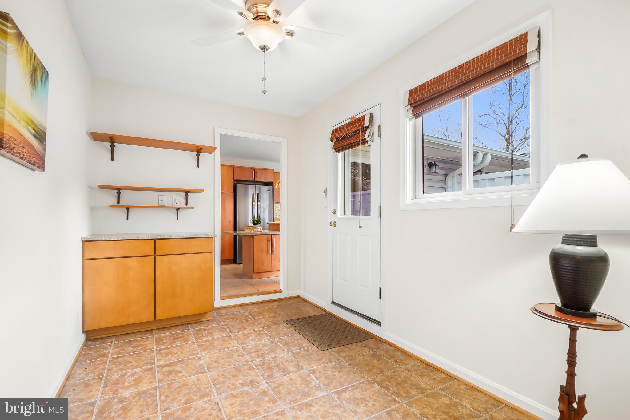 3506 Fiske Terrace, Unit 153A Silver Spring, MD 20906 - Photo 23 of 43 Den/mudroom has access to the garage & patio
