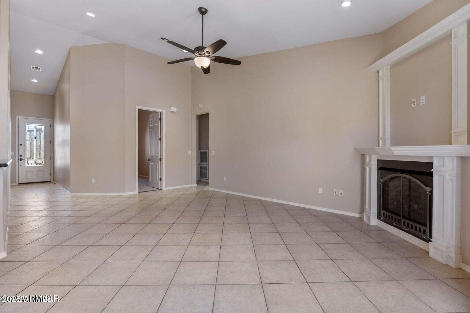 1058 East Adams Street Snowflake, AZ 85937 - Photo 13 of 36 an empty room with windows and fireplace