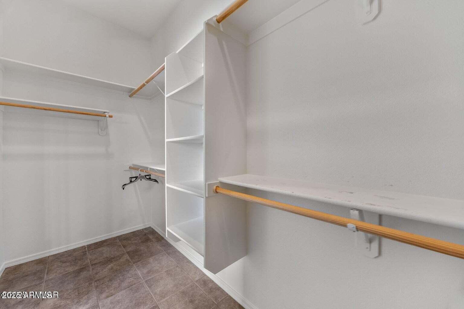 1058 East Adams Street Snowflake, AZ 85937 - Photo 16 of 36 a view of room with walk in closet