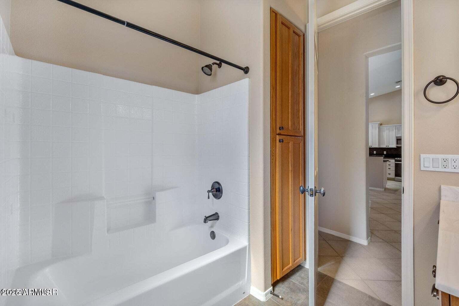 1058 East Adams Street Snowflake, AZ 85937 - Photo 18 of 36 a bathroom with a bathtub and a shower