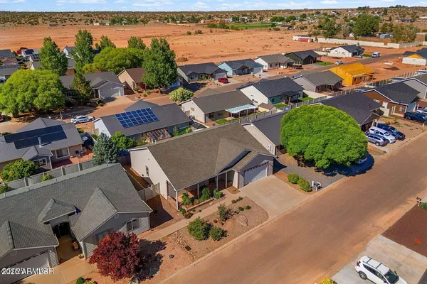 an aerial view of houses with outdoor space