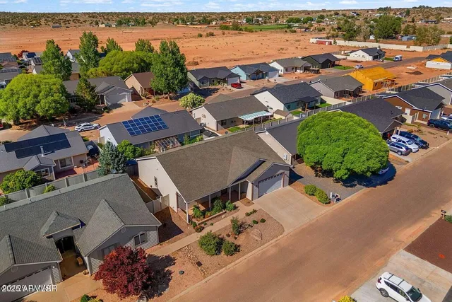 an aerial view of houses with outdoor space